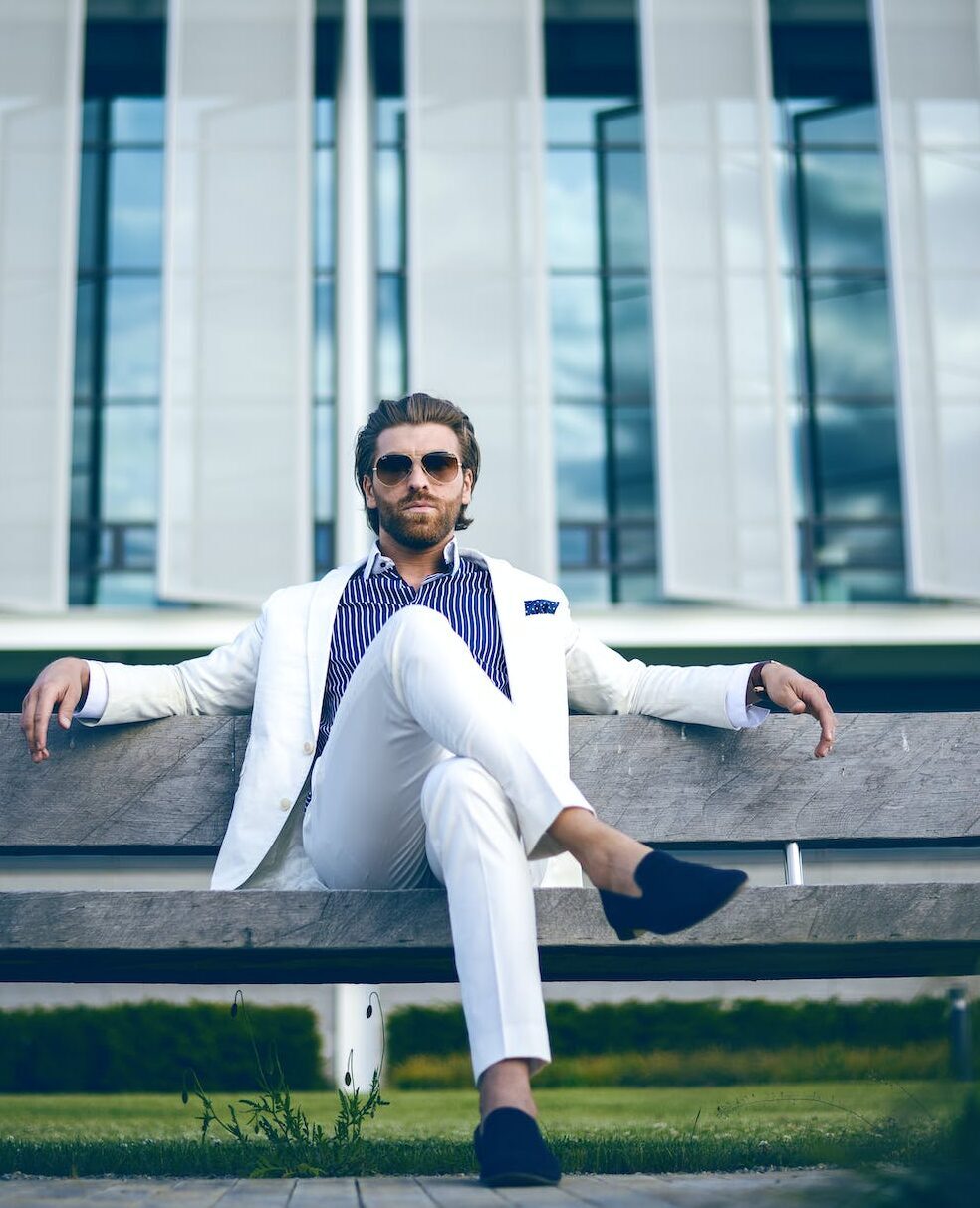 man wearing white suit jacket and white pants