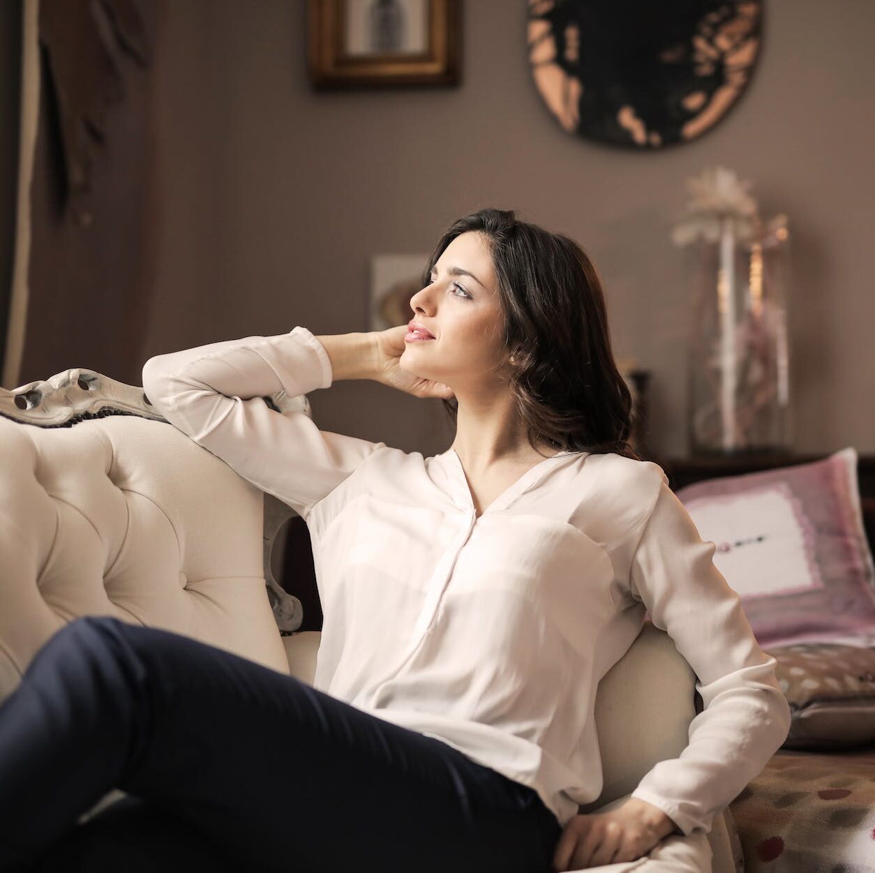 woman in white dress shirt and black pants