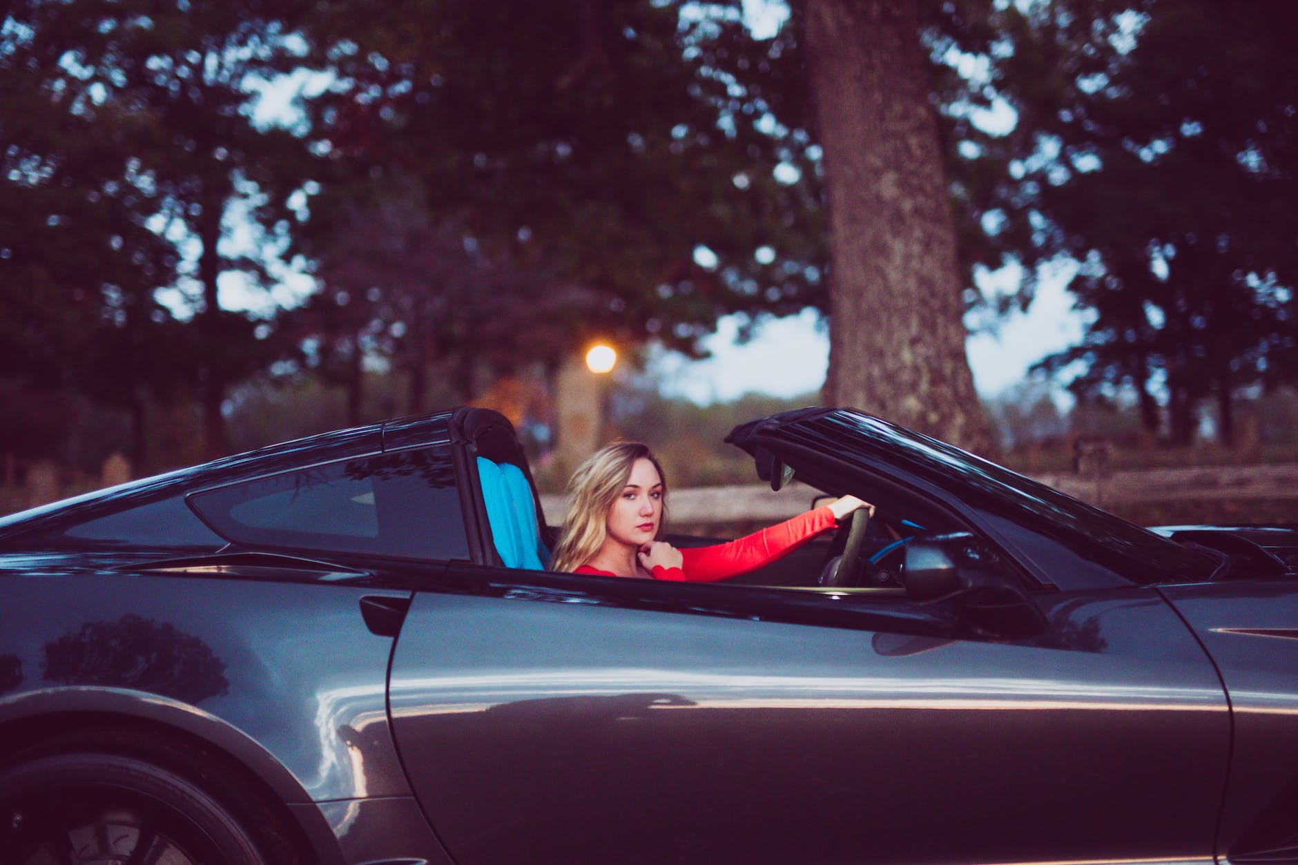 beautiful woman posing in car